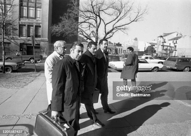 Three of the seven persons accused of burglarizing and bugging Democratic National Headquarters at the Watergate building arrive at U.S. District...