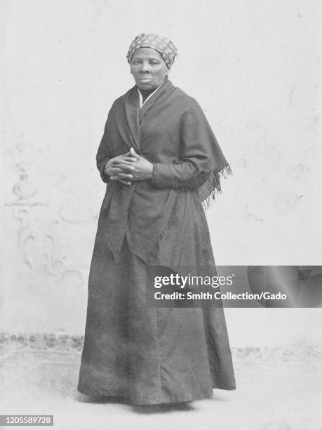 Full length portrait of activist Harriet Tubman in shawl with hands crossed, 1885. Courtesy Library of Congress.