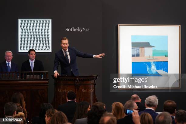 Auctioneer Oliver Barker brought the hammer down on David Hockney’s landmark pool painting ‘The Splash’, which achieved £23.1 million / $29.8 million...