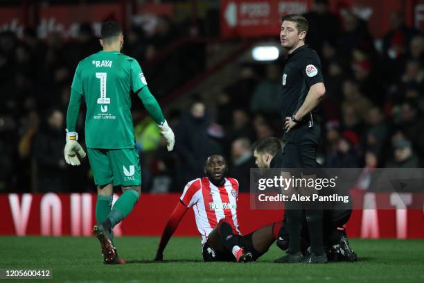 Josh Dasilva of Brentford is injured during the Sky Bet Championship match between Brentford and Leeds United at Griffin Park on February 11, 2020 in...