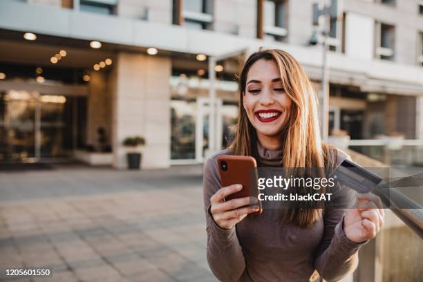 young woman buying online - paying stock pictures, royalty-free photos & images
