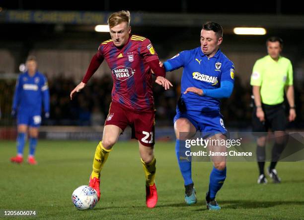 Flynn Downes of Ipswich Town is challenged by Anthony Hartigan of AFC Wimbledon during the Sky Bet League One match between AFC Wimbledon and Ipswich...