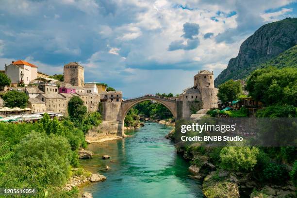 mostar bridge with blue sky, mostar, bosnia and herzegovina - mostar stock pictures, royalty-free photos & images