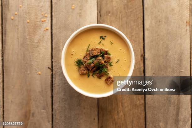 lentil soup in a wooden dish - celery soup stock pictures, royalty-free photos & images