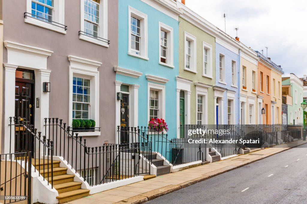 Street in residential district with row houses in London, UK