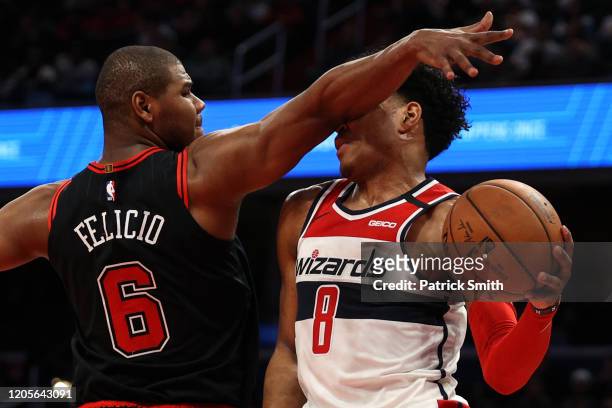 Rui Hachimura of the Washington Wizards is fouled by Cristiano Felicio of the Chicago Bulls during the second half at Capital One Arena on February...