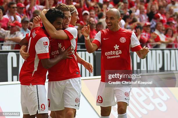 Sami Allagui of Mainz celebrates the first goal with Eugen Polanski and Elkin Soto during the Bundesliga match between FSV Mainz 05 and Bayer 04...