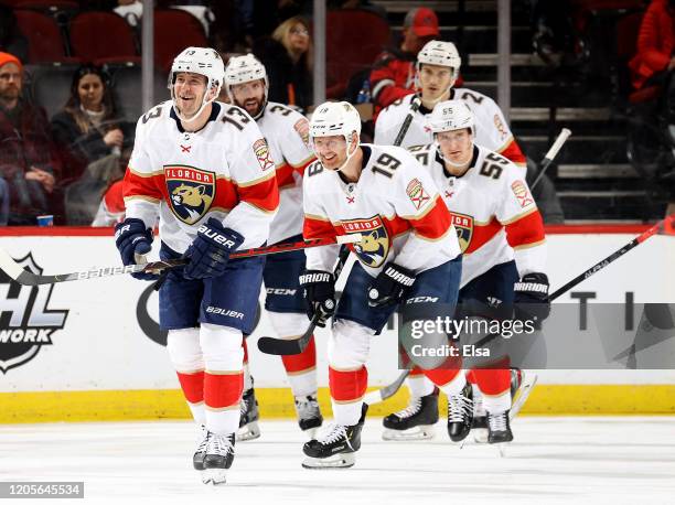 Mark Pysyk of the Florida Panthers celebrates his goal with teammates Mike Matheson and Noel Acciari in the second period against the New Jersey...