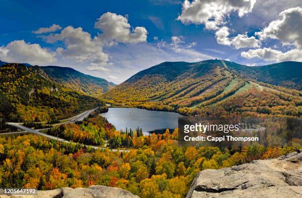 franconia notch in franconia, new hampshire usa seen from artist's bluff lookout during autumn - notch stock pictures, royalty-free photos & images