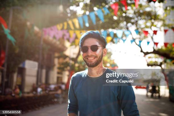 young man with blue hair wearing sunglasses - blue hair stock pictures, royalty-free photos & images