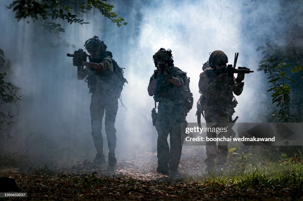 Battle of the military in the war. Military troops in the smoke