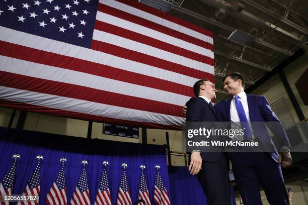 Democratic presidential candidate former South Bend, Indiana Mayor Pete Buttigieg appears on stage with his husband Chasten Buttigieg at his primary...