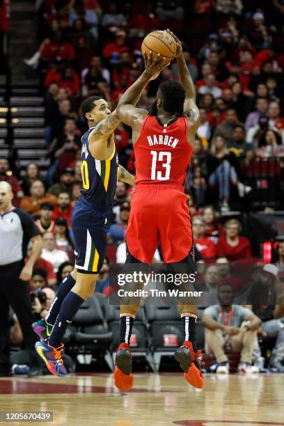 James Harden of the Houston Rockets shoots the ball defended by Jordan Clarkson of the Utah Jazz in the first half at Toyota Center on February 09,...