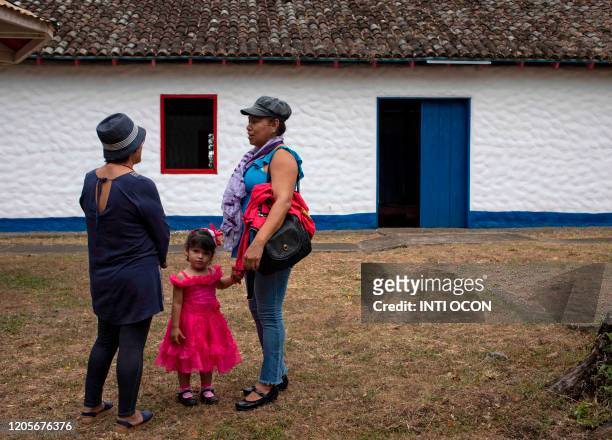 Women chat in Solentiname, Rio San Juan, Nicaragua, before a mass in honour of Nicaraguan late poet Ernesto Cardenal on March 7, 2020. - Cardenal,...