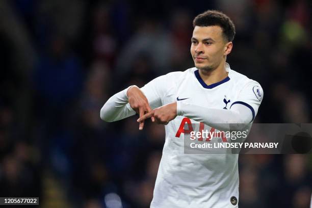 Tottenham Hotspur's English midfielder Dele Alli celebrates after scoring their first goal from the penalty spot during the English Premier League...