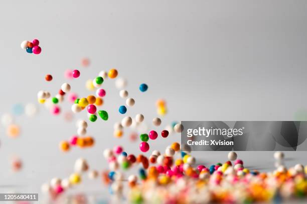 dance colorful sugar ball with vibrant colors - bouncing stockfoto's en -beelden