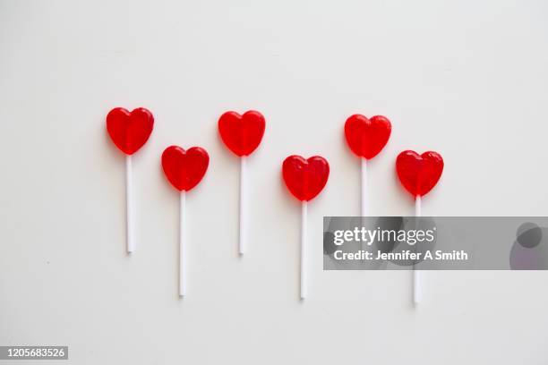 hearts in a row - lollipop man stock-fotos und bilder