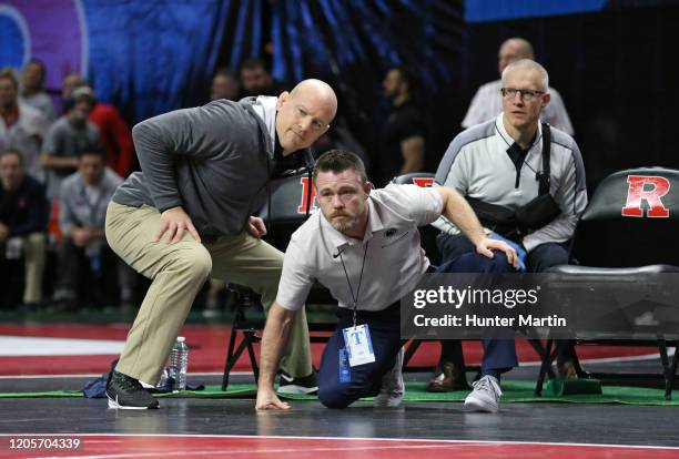 Head coach Cael Sanderson and assistant coach Cody Sanderson of the Penn State Nittany Lions coach a match during the Big Ten Championships at...
