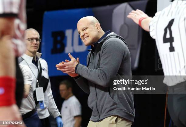 Head coach Cael Sanderson of the Penn State Nittany Lions celebrates after coaching a match during the Big Ten Championships at Rutgers Athletic...