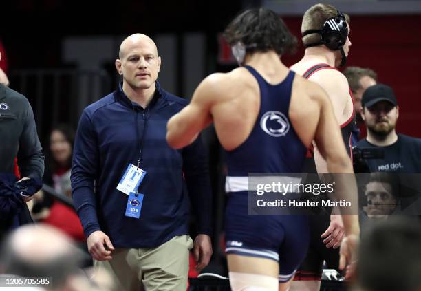 Head coach Cael Sanderson of the Penn State Nittany Lions coaches a match during the Big Ten Championships at Rutgers Athletic Center on the campus...