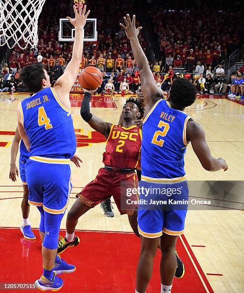Cody Riley Jaime Jaquez Jr. #4 and Cody Riley of the UCLA Bruins defend Jonah ...