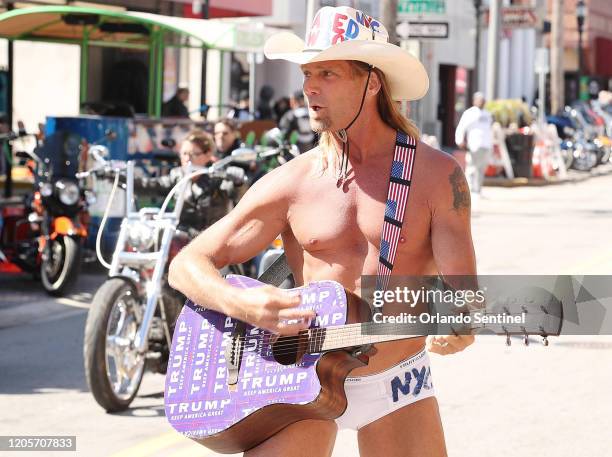 The "Naked Cowboy" performs during Bike Week in Daytona Beach, Fla., on Saturday, March 7, 2020.