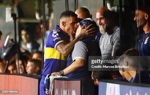 Diego Armando Maradona head coach of Gimnasia y Esgrima La Plata and Carlos Tevez of Boca Juniors kiss before a match between Boca Juniors and...