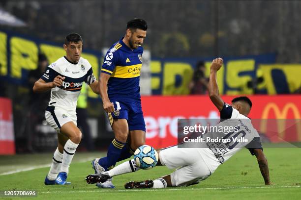 Matias Garcia of Gimnasia y Esgrima La Plata challenges Eduardo Salvio of Boca Juniors during a match between Boca Juniors and Gimnasia as part of...