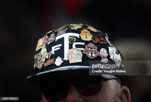 Toronto FC fan wears a hot covered in button during the second half of an MLS game between New York City FC and Toronto FC at BMO Field on March 07,...