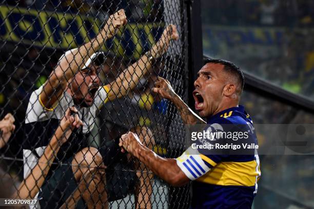 Carlos Tevez of Boca Juniors celebrates after scoring the first goal of his team with fans during a match between Boca Juniors and Gimnasia as part...