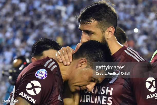 Lucas Pratto of River Plate comforts teammate Enzo Perez after equalizing a match between Atletico Tucuman and River Plate as part of Superliga...