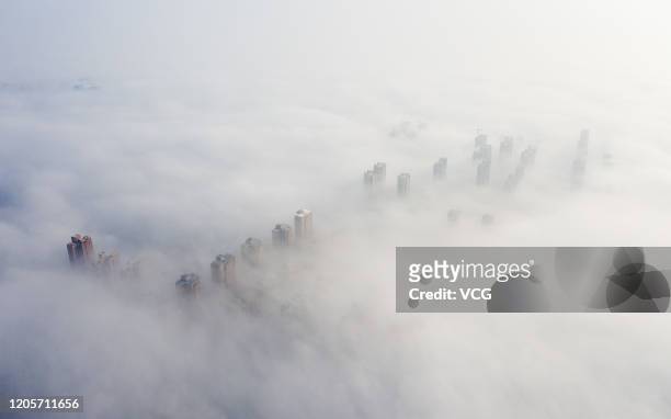 Aerial view of advection fog surrounding buildings on February 12, 2020 in Huaibei, Anhui Province of China.