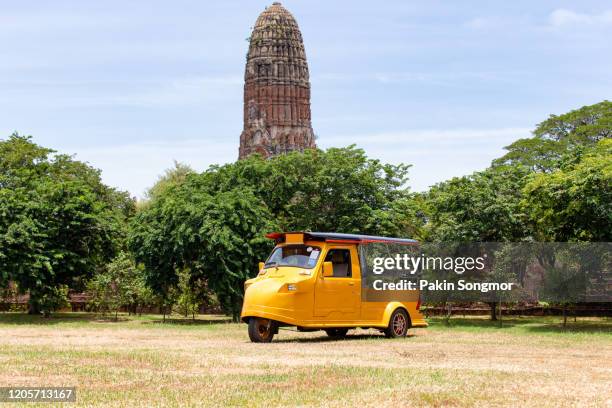 tuk tuk car tourist at parking outdoors with wat mahathat background - auto rickshaw stock pictures, royalty-free photos & images