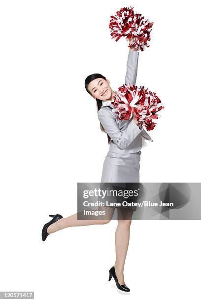 a businesswoman cheering with pompoms - asian cheerleaders ストックフォトと画像