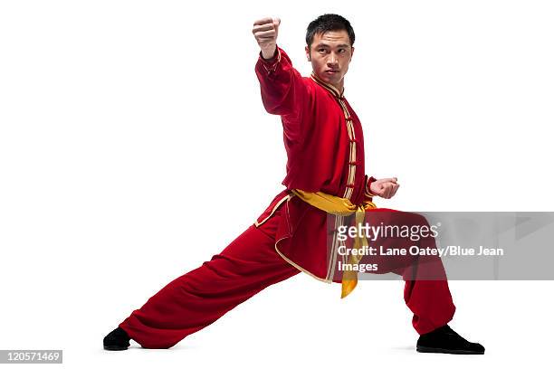 man in traditional chinese clothing doing martial arts - chinese martial arts stock pictures, royalty-free photos & images