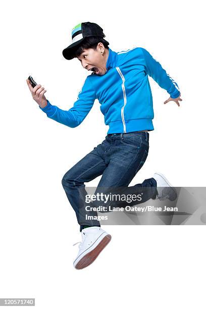 386 Asian Guy Jump With Phone Stock Photos, High-Res Pictures, and ...