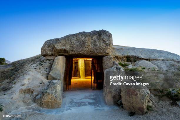 dolmen of menga in antequera, malaga, spain - doelman stock-fotos und bilder