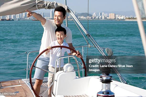 father and son bonding - father son sailing stock pictures, royalty-free photos & images
