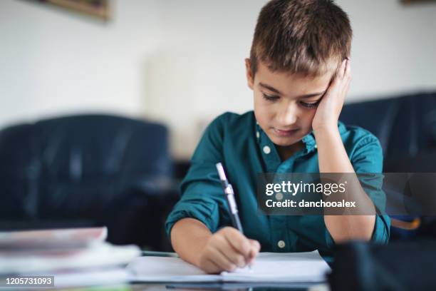 Kid Ripping Up Homework Child Struggling In School Photos and Premium High Res Pictures - Getty ...