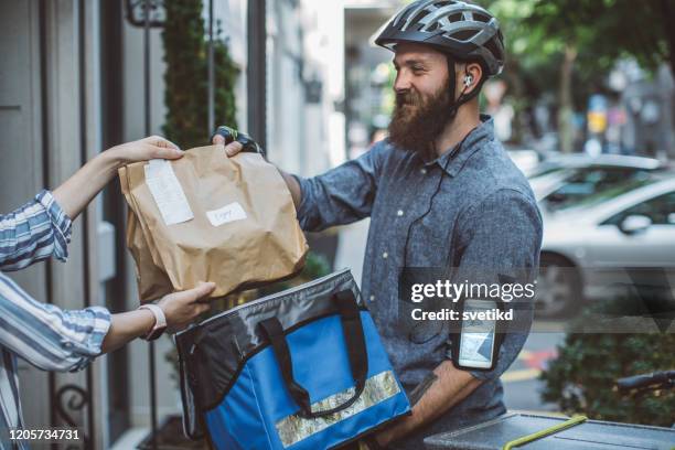 food delivery - bicycle messenger stock pictures, royalty-free photos & images