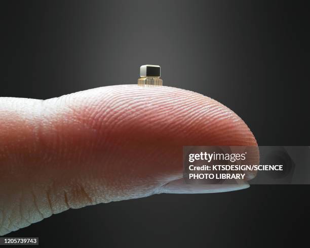 microchip on finger - nanotecnología fotografías e imágenes de stock