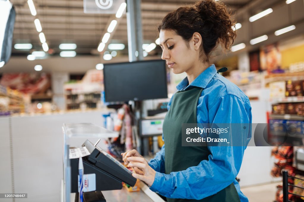 Female Latina employee in supermarket