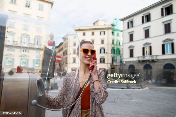 connecting across the world - telefonzelle stock-fotos und bilder