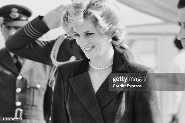 British royal Diana, Princess of Wales , wearing an outfit designed by Catherine Walker, with pearl earrings and a pearl necklace, 19th April 1985.