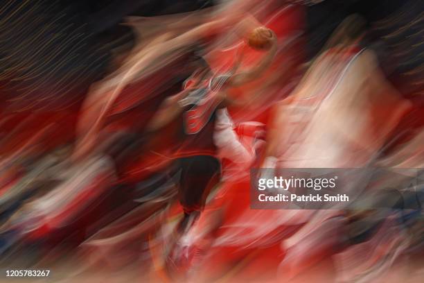 Bradley Beal of the Washington Wizards drives in the lane past Cristiano Felicio of the Chicago Bulls during the first half at Capital One Arena on...