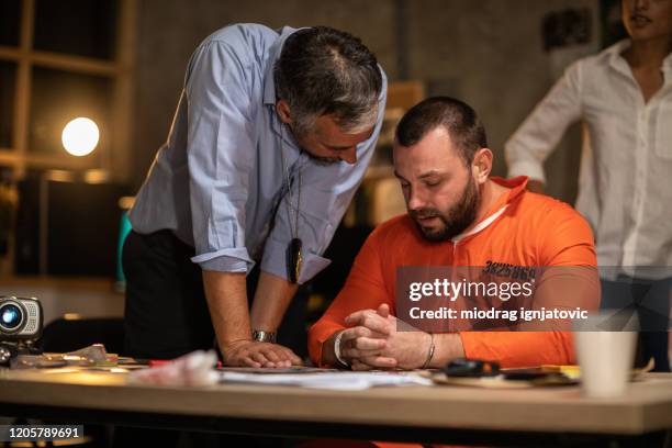 Interviewing Inmate Prisoner With Handcuffs Being Interviewed In Interrogation Room High ...