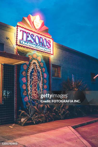 vibrant rainy street historic district in austin-texas at night - austin nightlife stock pictures, royalty-free photos & images