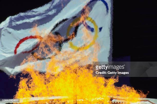 Flames from the cauldron rise in front of the official Olympic flag during the Opening Ceremony of the XXIV Summer Olympic Games on 17th September...