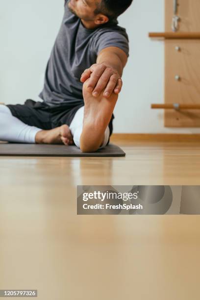 a man doing yoga - pilates abstract stock pictures, royalty-free photos & images