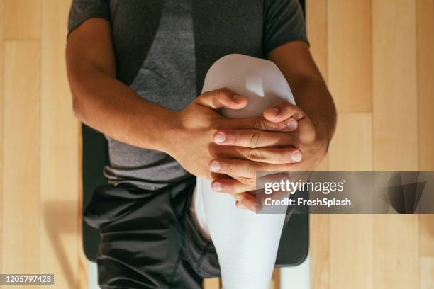 sportsman stretching his leg - pilates abstract stock pictures, royalty-free photos & images